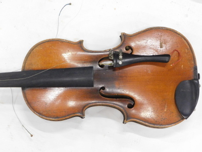 A late 19thC/early 20thC violin, with a two piece back, length of back 36cm, sold with a bow and a hardwood veneered case. - 2