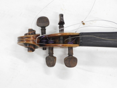 A late 19thC/early 20thC violin, with a two piece back, length of back 36cm, sold with a bow and a hardwood veneered case. - 3