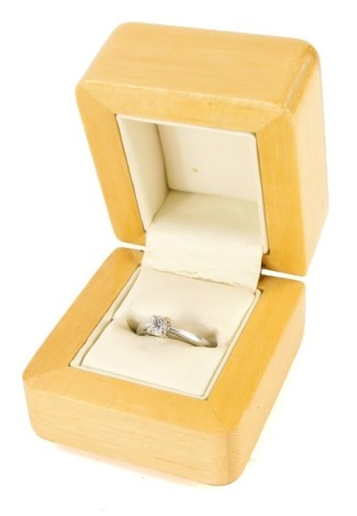 An 18ct gold diamond solitaire ring, set with round brilliant cut stone totalling approximately 0.33cts, with diamond guarantee certificate stating colour and clarity of J to K and I2, ring size K½, 2g. (boxed)