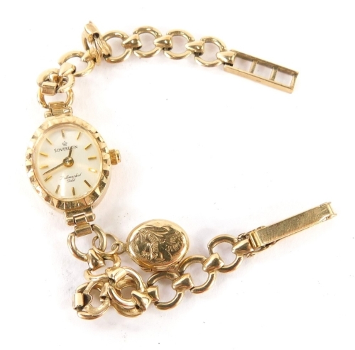 A Sovereign 9ct gold cased ladies wristwatch, with small oval watch head and applied oval locket pendant, on a loop design 9ct gold bracelet, 18cm long, 10.1g all in.