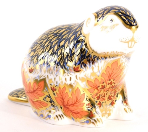 A Royal Crown Derby porcelain paperweight of Riverbank Beaver, limited edition number 3501 of 5000, with gold coloured stopper, 7cm high, boxed.