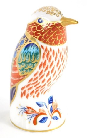 A Royal Crown Derby porcelain paperweight of a Hummingbird, with gold coloured stopper, 10cm high, boxed.