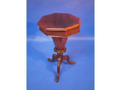 A Victorian burr walnut hexagonal sewing table on carved tripod base