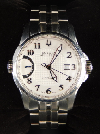 A Bulova Accutron gentleman's stainless steel wristwatch, having guilloche effect centre dial with raised chaptering, having applied Arabic numeral markers and a surrounding minute track, with calibration dial to nine o'clock and date aperture to three o'