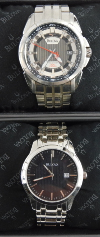 Two Bulova gentleman's wristwatches, having a black dial with stainless steel bracelet, and a grey dial with stainless steel bracelet.