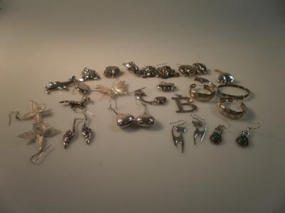 A collection of modern white metal jewellery including animal figures