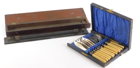 An early 20thC brass and patinated metal draughtsman's rule, in mahogany case, and a set of six fish knives and forks.