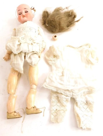 A bisque headed doll, the reverse stamped 1909, 0 Germany, with composition limbs etc. (AF).