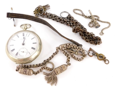 An A W Wolfman and Co silver plated pocket watch, with a silver plated chain and various keys, with filigree decorated fob.