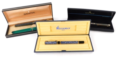 A Sheaffer fountain pen, with similar ballpoint pen, a Waterman ballpoint pen, and a Diplomat propelling pencil. (4)