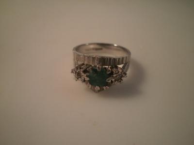 An emerald and diamond 18ct white gold dress ring