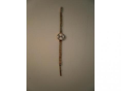 A UNO 17 jewel Incabloc 9ct ladies wristwatch on a 9ct gold bracelet strap