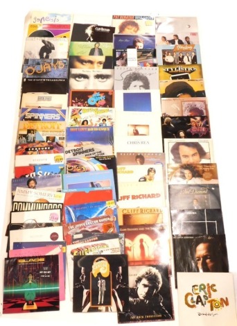 A quantity of mixed rock and pop records, to include Huey Lewis & The News, Eric Clapton, Communards, Simply Red, Dire Straits, The Spinners, Erasure, a number of Cliff Richard, etc. (1 box)