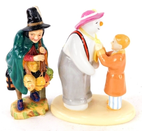 A Royal Doulton Miniature Street Vendors figure The Mask Seller, and a Coalport Characters figure group The Snowman The Finishing Touch no. 1520. (2)