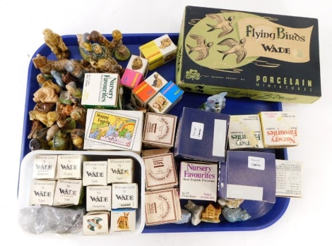 A large quantity of Wade figurines, Whimsies in boxes, a vintage set of Wade flying birds (boxed), Wade Bear Ambitions figures, Nursery Favourites, etc. (1 tray)