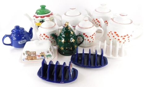 Various Wade novelty and other teapots, to include Goose Fair, a pair of Tetley Tea toast racks, etc.