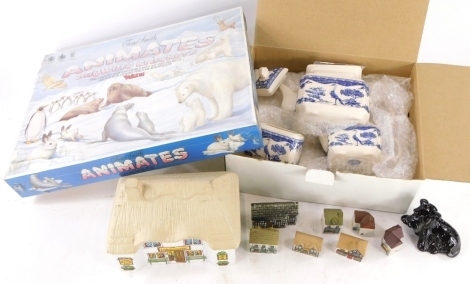 A quantity of Wade cottages, to include the Village Stores, Time At Stag, a membership's special Scottie dog with badge, membership magazines, a boxed Tom Smith Animates Snow Life Wade crackers, and a boxed Wade blue and white tea set.