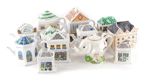A quantity of Wade novelty shop and cottage shaped teapots, etc.