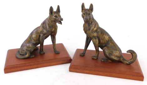A pair of gilt spelter of Alsatians or wolves, each on a mahogany plinth, 16cm high.