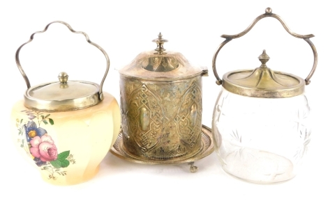 A silver plated and embossed biscuit barrel, cut glass biscuit barrel with silver plated mounts and a blush ivory biscuit barrel with silver plated mounts. (3)