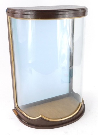 A tabletop small bowfronted display cabinet, with painted and gilt decoration, 35cm high, 31cm wide.