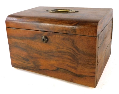 A Victorian walnut jewellery box, with an inset engraved brass handle to the hinged lid, the interior lined in leather and fitted with velvet hinged compartments and with a Bramah lock, 30cm wide.