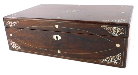 A Victorian rosewood and mother of pearl inlaid writing box, the hinged lid enclosing a later green leatherette slope, 41cm wide.