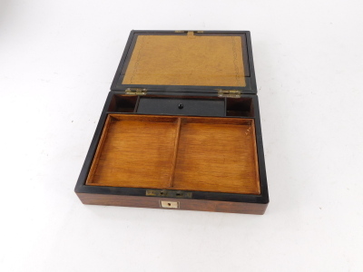 A Victorian rosewood writing box, the top with a vacant rectangular mother of pearl cartouche enclosing a fitted interior with later slope and fitted tray, etc., 27cm wide. - 2