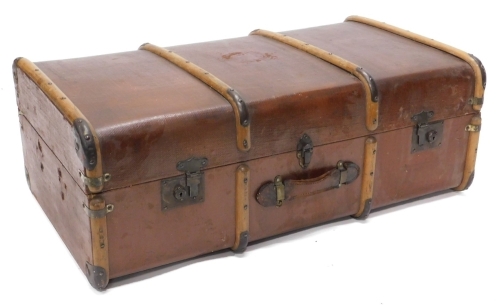 A canvas and wooden bound trunk with leather handle, 92cm wide.