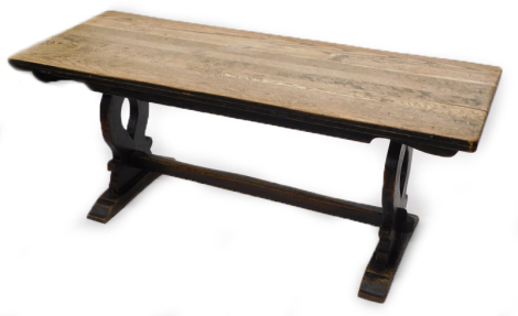 A rectangular oak refectory table, with a plank top on pierced end supports, 73cm high, the top 65cm x 178cm . Provenance: The Wheatsheath Public House, Maids Morton Buckinghamshire, by family repute Margaret Thatcher's pearls were strung on this table.