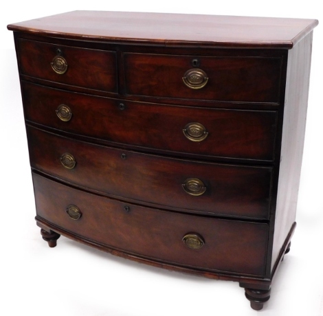 A Victorian mahogany bowfronted chest, with two short and three long drawers, on turned feet, 106cm wide.