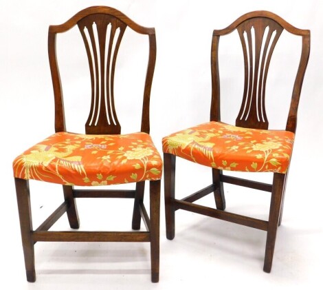 A pair of 19thC elm dining chairs, each with a pierced splat and a padded seat, adapted.