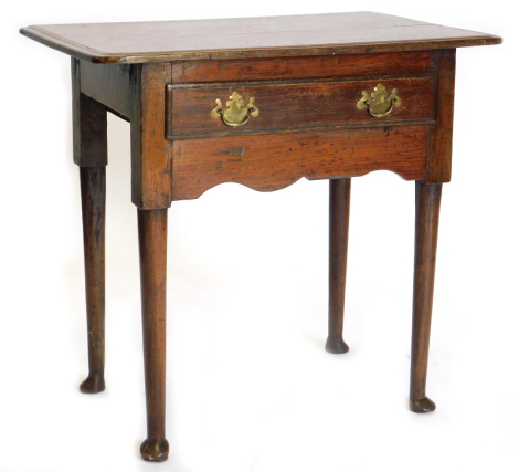 A late 18th/early 19thC oak lowboy, the top with a moulded edge above a frieze drawer, on turned tapering legs with pad feet, 79cm wide.