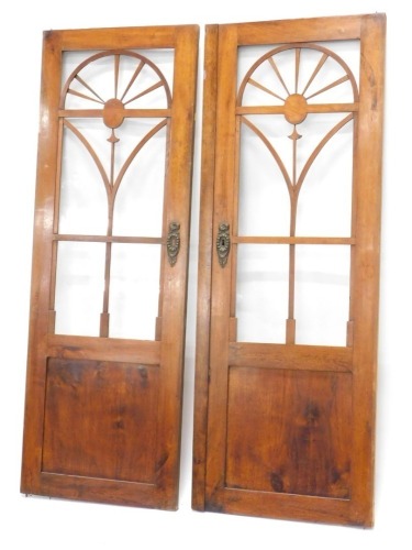 A pair of continental mahogany wardrobe doors, each with glazed central section above a panel, 152cm high, 60cm x 56cm wide respectively.