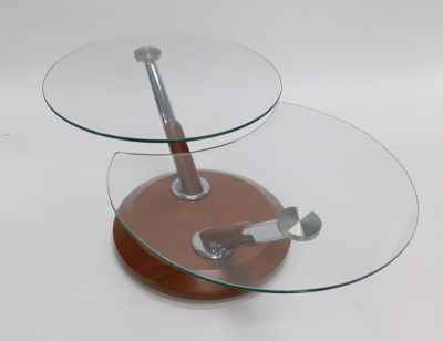 A modern glass topped coffee table, with chrome plated supports and hardwood base, 69cm diameter. - 2