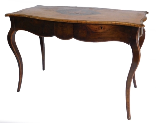 A 19thC walnut library table in French style, the shaped rectangular top with a central marquetry cartouche of flowers on an ebony ground, within tulipwood crossbanded borders, above two frieze drawers on crossbanded cabriole legs, 71cm high, 105cm wide,