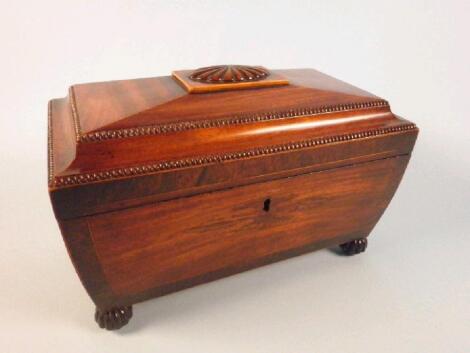 A George IV mahogany and rosewood cross banded sarcophagus shaped tea chest