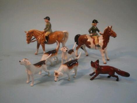 A Beswick skewbald pony and child figure