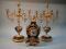 An Italian porcelain and gilt metal clock garniture