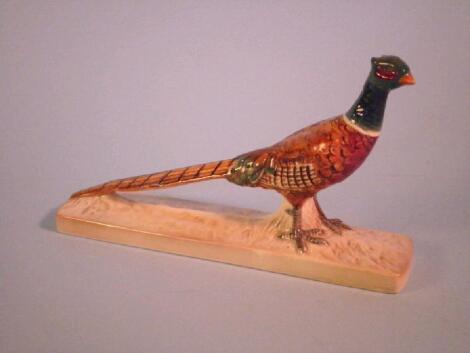 Beswick. A pheasant on a pottery base