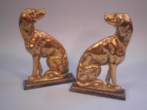 A pair of 19thC brass and cast iron door stops