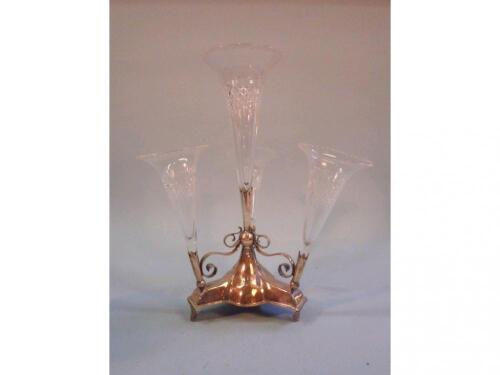 A late Victorian/Edwardian silver plated epergne with four cut glass trumpet