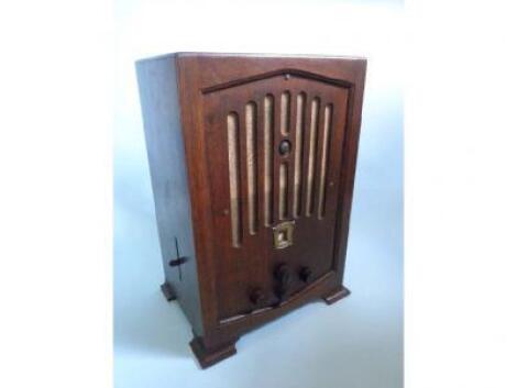 A KB Kobra oak cased radio in the Art Deco style with bakelite fittings
