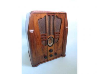 A Philco radio in a walnut case in the Art Deco style with bakelite fittings