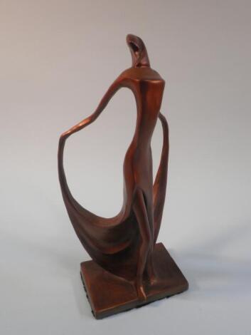 A modern bronze sculpture of a young lady wearing a flowing dress on a square base