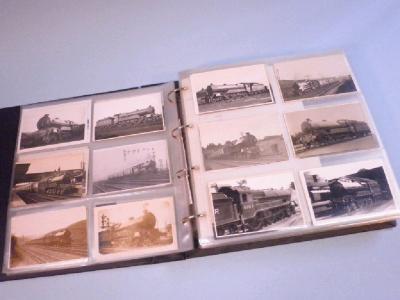 An album of photographs and photographic postcards containing locomotives