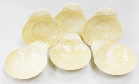 A rare set of six Belleek third period black mark shell butter dishes, 1926-49, the dishes formed as scallop shells, 13cm diameter. (6)