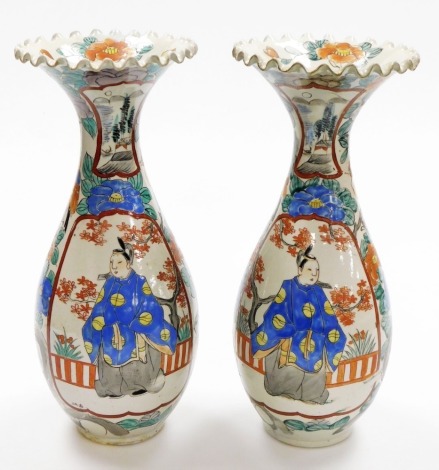 A pair of Japanese porcelain ovoid vases, with frill necks, decorated with enamelled panels of standing figures all within a floral background, Meiji period, 36cm high.