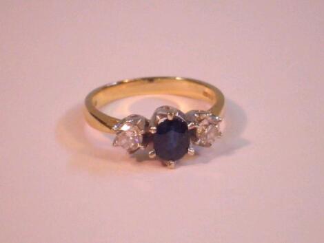 A sapphire and diamond ring set in 9 ct gold