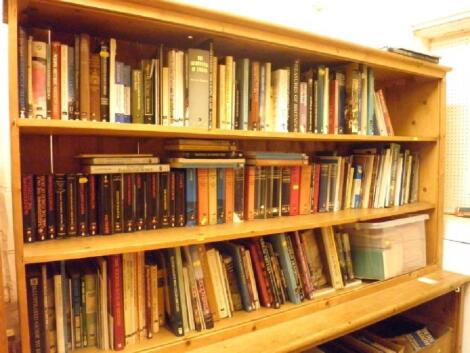 Three shelves of books on historical subjects